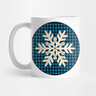 Snowflake silhouette over a black and blue tile pattern Mug